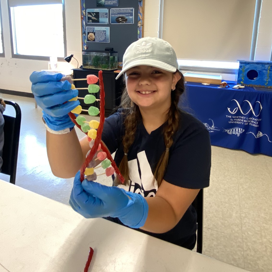 Girl holding dna made from candy