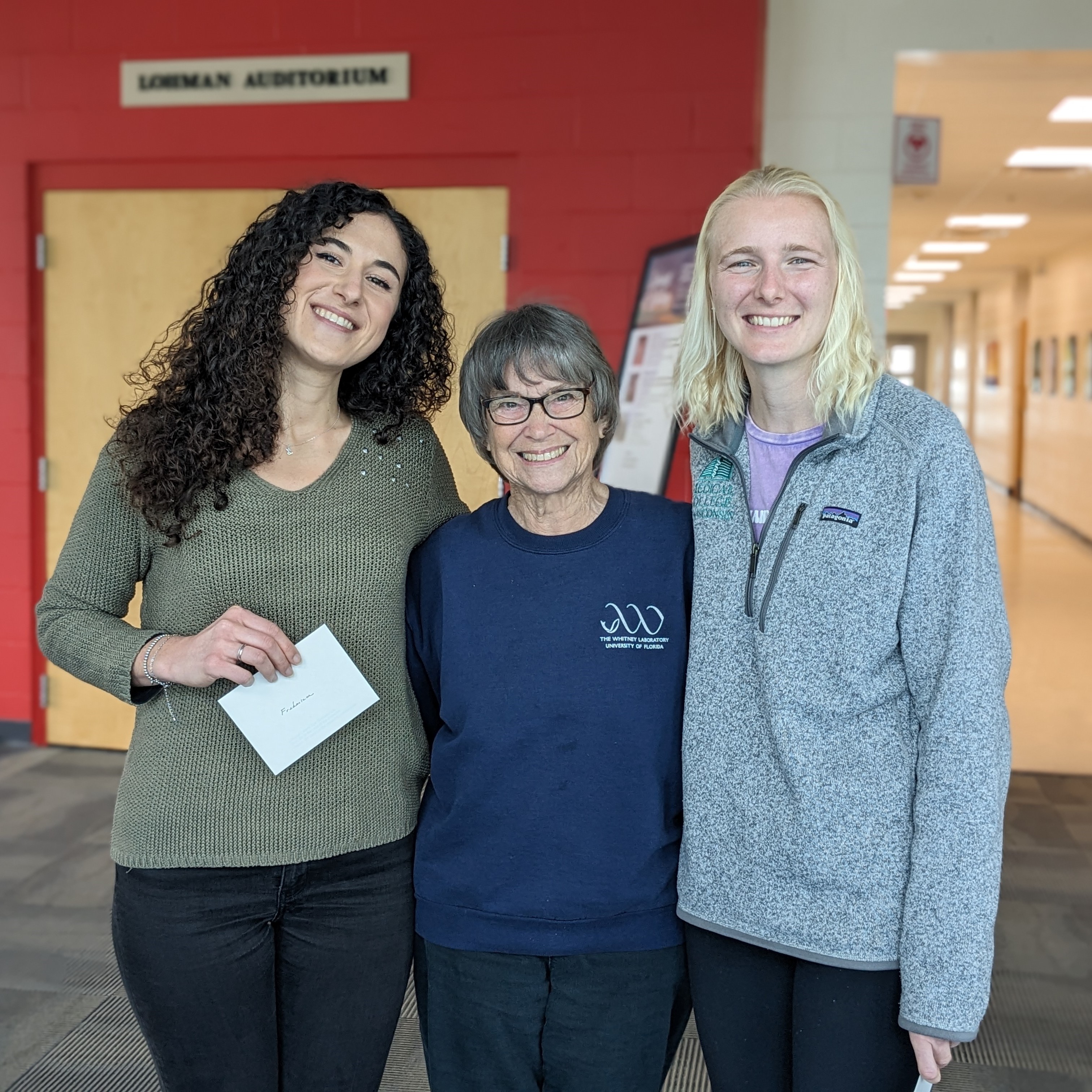 Three women smiling