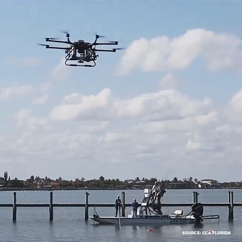 Drone over waterway with dock and boat