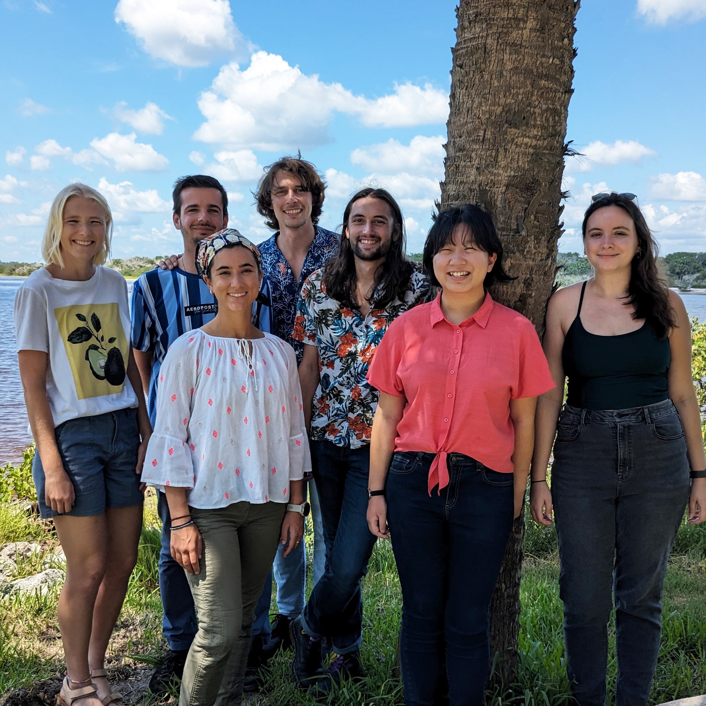 Group of graduate students standing in front of estuary