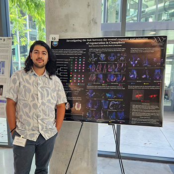 Person with scientific poster