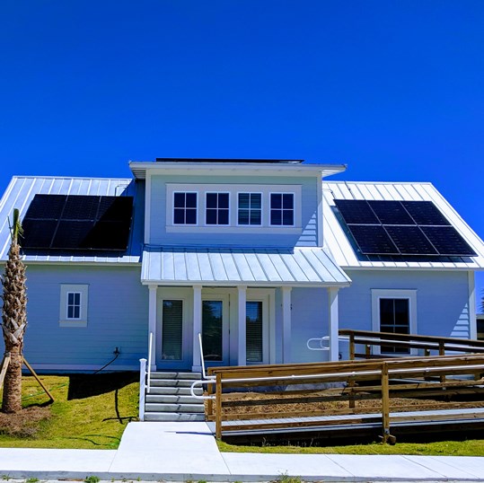 First Whitney Research Village Cottage Goes Solar
