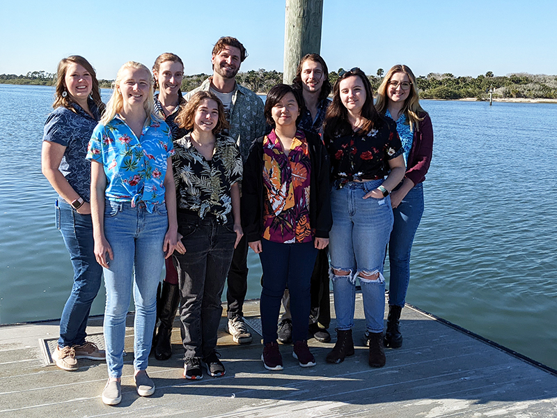 Group of students standing on a dock