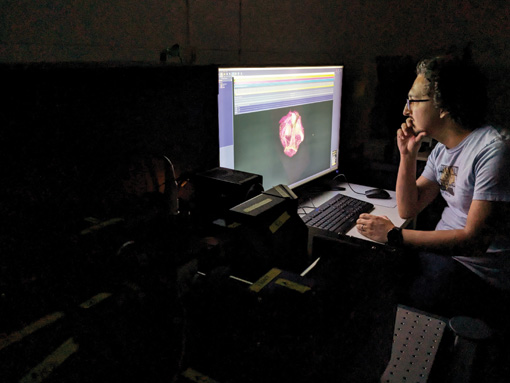 Scientist looking at computer