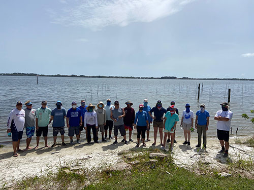 Group of people who deployed 60K clams into the Indian River Lagoon