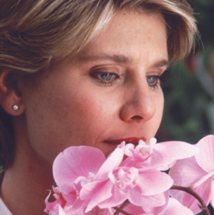 Woman smelling flower