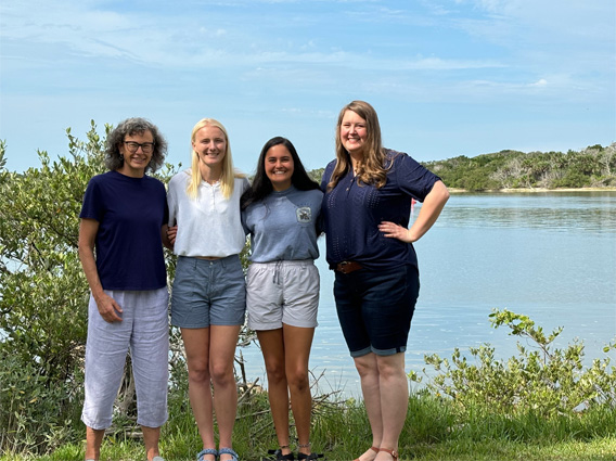 Group of people standing in front of waterway